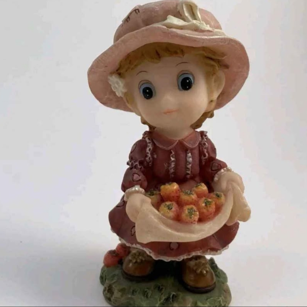 Charming Figurine with Pink Dress and Hat